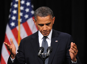 President Obama speaks at an interfaith vigil for the shooting victims from Sandy Hook Elementary School on Sunday at Newtown High School in Newtown, Connecticut.