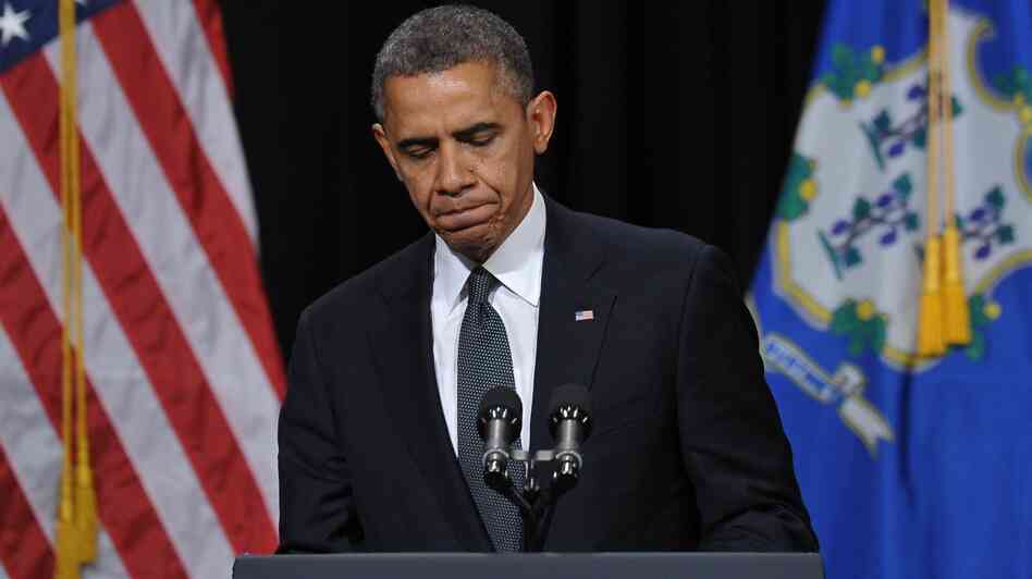 President Barack Obama speaks at a memorial service for victims of the Sandy Hook Elementary School shooting. "I come to offer the love and prayers of a nation," he told the crowd in Newtown, Conn., Sunday.