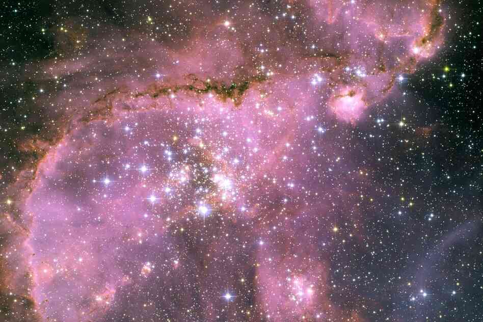 "A view of one of the most dynamic and intricately detailed star-forming regions in space, located 210,000 light-years away in the Small Magellanic Cloud (SMC), a satellite galaxy of our Milky Way."