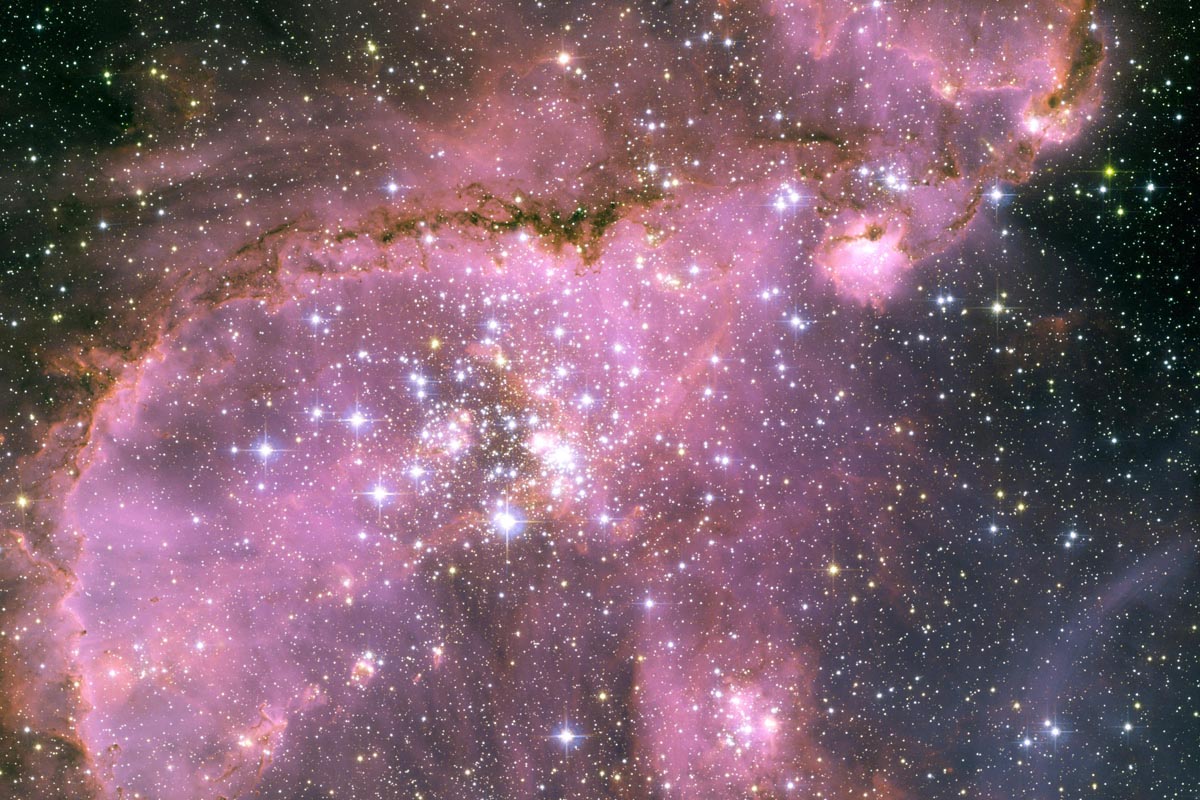 "A view of one of the most dynamic and intricately detailed star-forming regions in space, located 210,000 light-years away in the Small Magellanic Cloud (SMC), a satellite galaxy of our Milky Way."