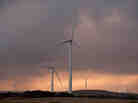 Wind generators at Pacific Hydro's Cape Bridgewater wind farm in Warrnambool, Australia, in May 2012. Each generator produces roughly enough energy to meet the annual needs of 12,000 households. Wind generators at Pacific Hydro's Cape Bridgewater wind farm in Warrnambool, Australia, in May 2012. Each generator produces roughly enough energy to meet the annual needs of 12,000 households.