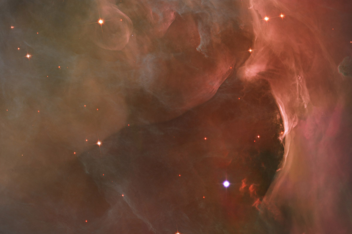 "This glowing region reveals arcs and bubbles formed when stellar winds ... collide with material in the Orion Nebula."