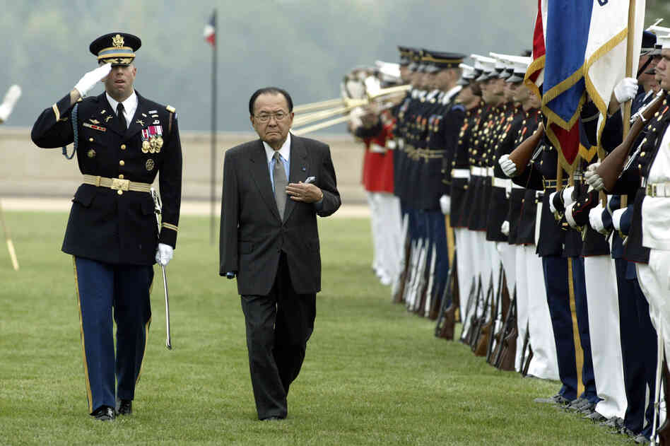 Inouye, escorted by Army Gen. Charles Taylor, inspects the troops outside the Pentagon during the annual National POW/MIA Recognition Day ceremony Sept. 14, 2004. Inouye lost his arm in World War II combat.