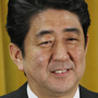 Liberal Democratic Party President Shinzo Abe smiles during a news conference at party headquarters in Tokyo on Monday, a day after the party's landslide victory in parliamentary elections.