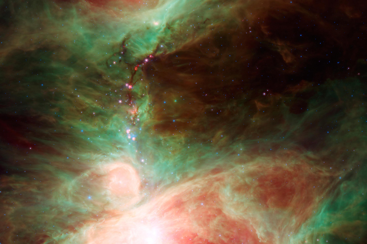 "This image ... shows what lies near the sword of the constellation Orion -- an active stellar nursery containing thousands of young stars and developing protostars."