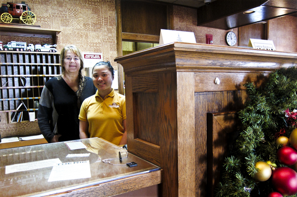 Cyndy Aafedt (left) owns the El Rancho hotel in Williston, N.D. Jobs in town have been hard to fill. Her employee, Mary Joy Hardt (right), who is from the Philippines, is one of many people with J-1 visas helping to fill retail, hotel and restaurant job openings here.
