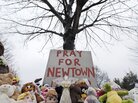 Stuffed animals and a sign calling for prayer lay at the base of a tree near the Newtown Village Cemetery in Newtown, Conn., on Monday, in remembrance of the victims of the mass shooting at Sandy Hook Elementary School. Stuffed animals and a sign calling for prayer lay at the base of a tree near the Newtown Village Cemetery in Newtown, Conn., on Monday, in remembrance of the victims of the mass shooting at Sandy Hook Elementary School.