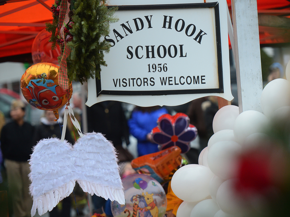 Angel wings and balloons at a makeshift shrine outside Sandy Hook Elementary. Angel wings and balloons at a makeshift shrine outside Sandy Hook Elementary.