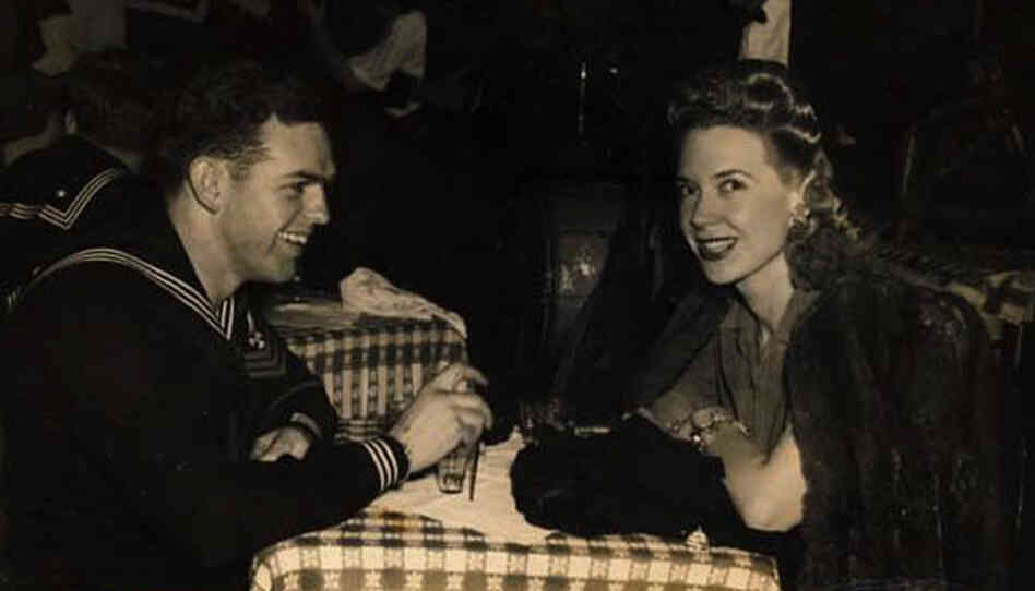 Creore sits with a sailor at the Stage Door Canteen in New York. "They were all homesick," she recalls.