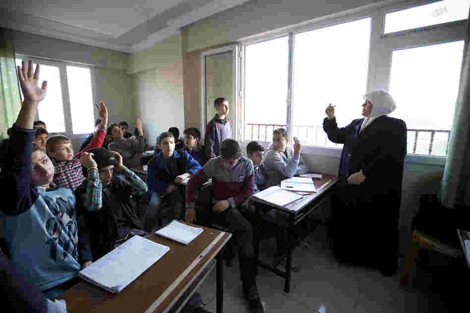 Teacher Emine Kusa leads a Turkish class for eighth-graders. Albashayer opened nearly two years ago when refugees began arriving in southern Turkey. A second building was recently opened to accommodate the growing number of students.