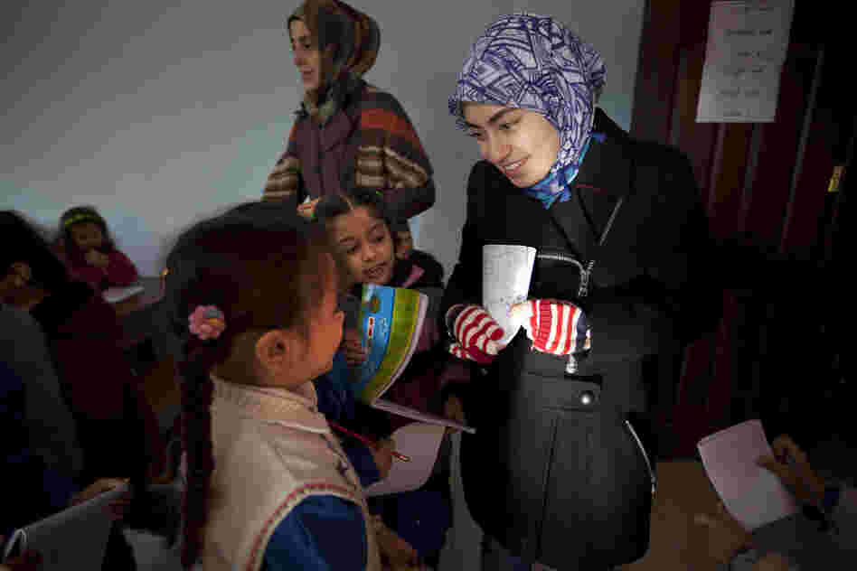 Rola Kadi, a Syrian-American from Michigan, has been volunteering as an art teacher at the school.