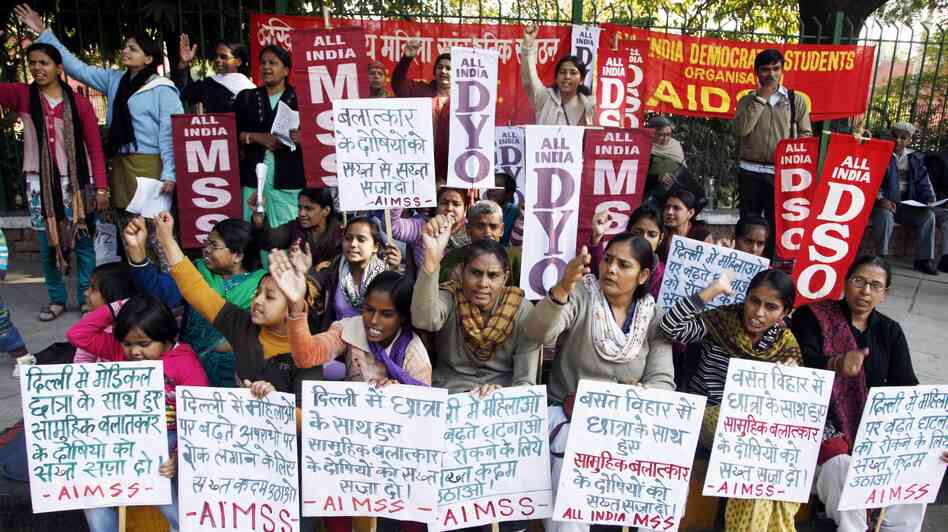 Indian women and children in New Delhi stage a protest Tuesday to condemn the gang rape of a 23-year-old student on a city bus.