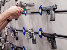 A visitor handles a revolver at a Smith & Wesson display during the NRA Annual Meetings and Exhibits on April 14 at America's Center in St. Louis, Mo. A visitor handles a revolver at a Smith & Wesson display during the NRA Annual Meetings and Exhibits on April 14 at America's Center in St. Louis, Mo.