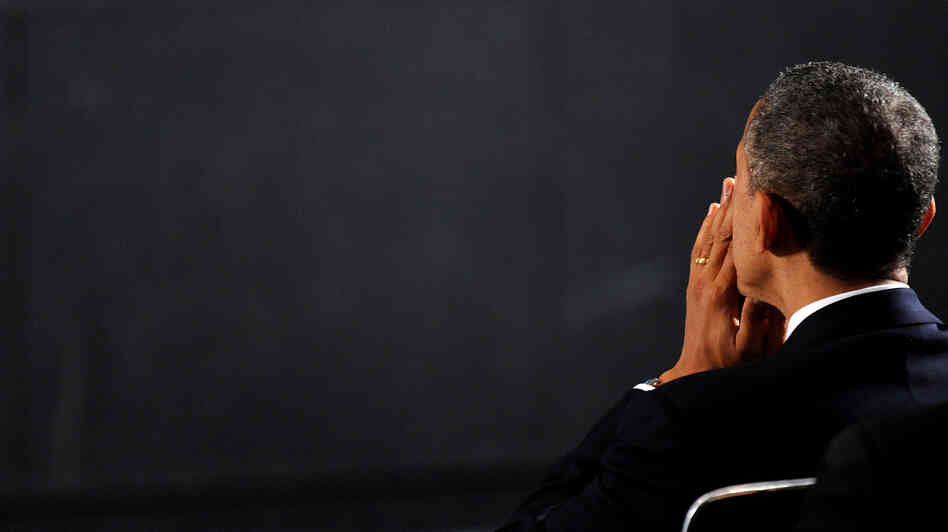 President Obama attends a vigil for the Sandy Hook Elementary School shooting victims on Sunday in Newtown, Conn.