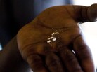 A whoonga smoker near Durban, South Africa, shows a crushed AIDS pill in the palm of his hand before mixing the drug with marijuana. A whoonga smoker near Durban, South Africa, shows a crushed AIDS pill in the palm of his hand before mixing the drug with marijuana.