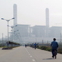 China and India are projected to propel coal's challenge of oil as the world's top energy source within the next five years, according to a new study. Here, a man rides a bicycle toward a coal-fired power station in China's Guangdong province last year. China and India are projected to propel coal's challenge of oil as the world's top energy source within the next five years, according to a new study. Here, a man rides a bicycle toward a coal-fired power station in China's Guangdong province last year.