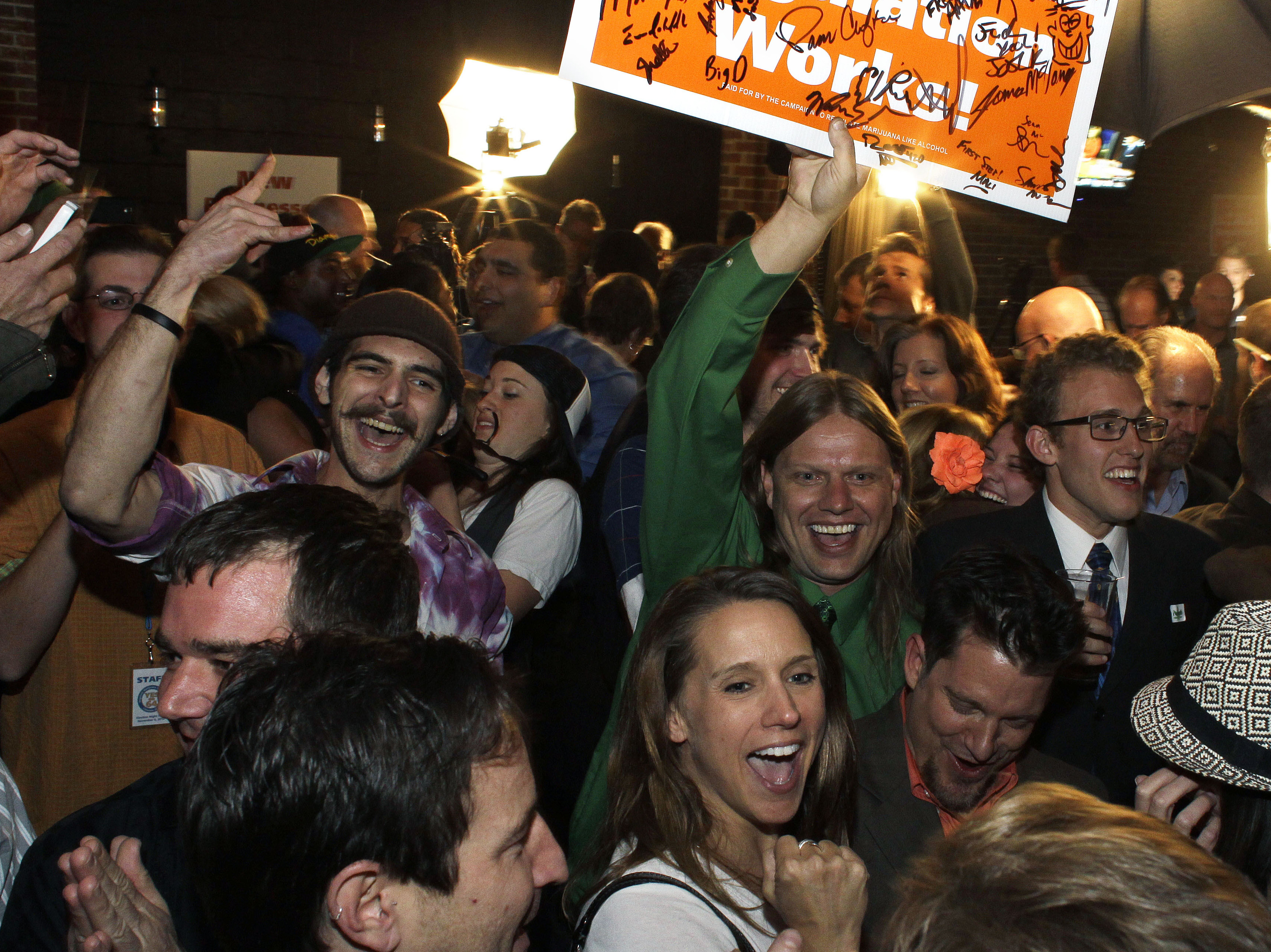 People at a Denver party early this month celebrate the recognition of an amendment to the Colorado constitution legalizing recreational use of marijuana.