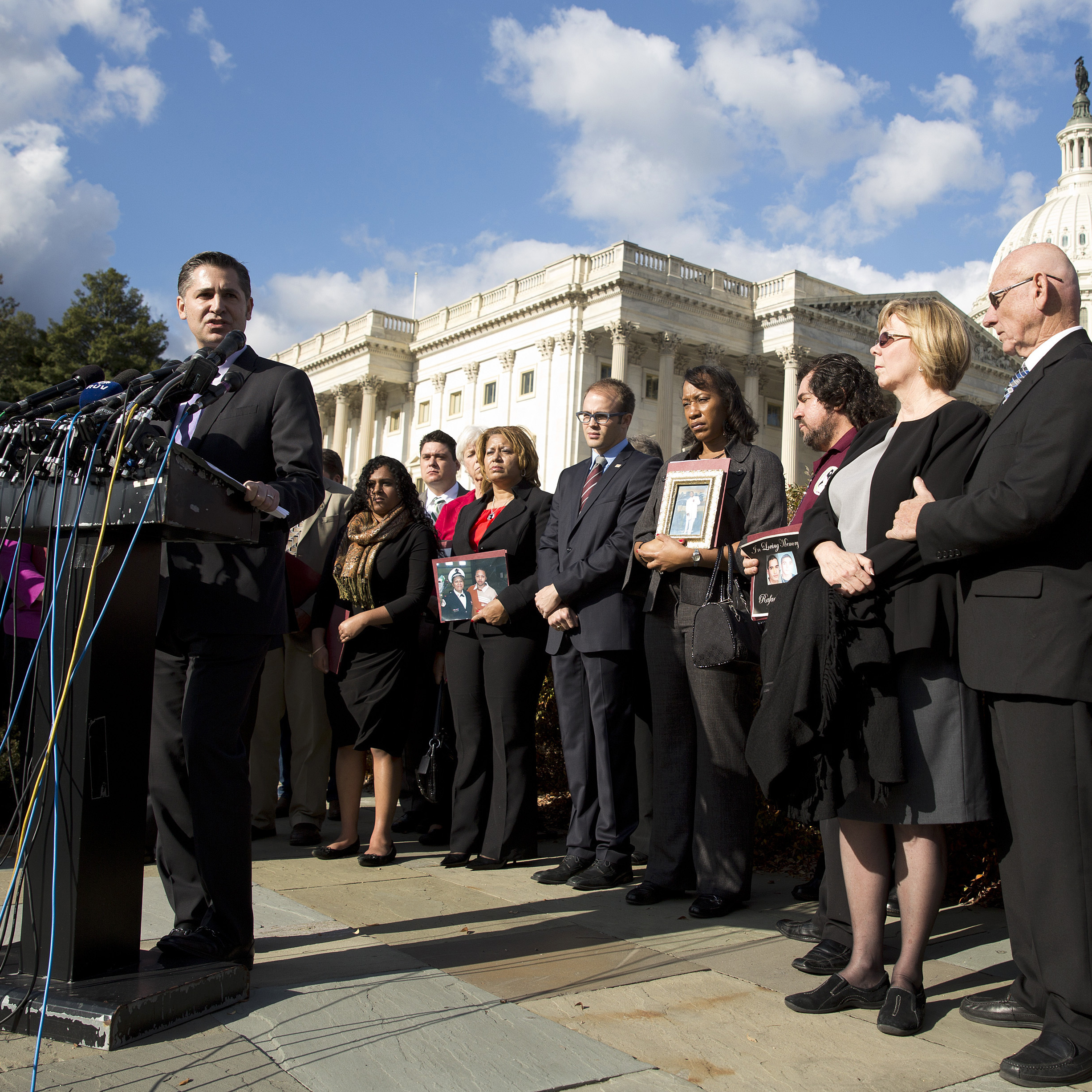 Dan Gross, president of the Brady Campaign to Prevent Gun Violence, calls on Congress to address gun violence at a news conference on Capitol Hill on Tuesday. More than 20 family members and victims of mass shootings across America joined him.
