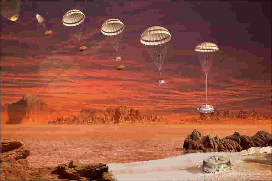 An artist's concept showing the descent and landing of the Huygens probe on Titan in January 2005.