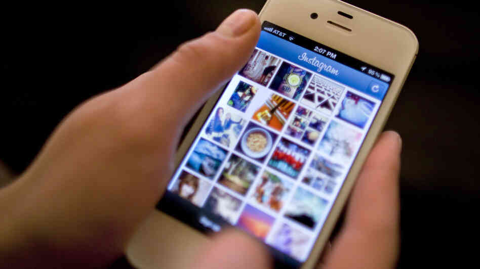 Instagram was the target of a storm of outrage on Twitter and other sites after the company announced a change in its user agreement that hinted that it might use shared photos in ads.