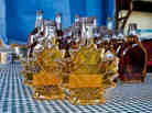 Fresh maple syrup in two maple leaf-shaped bottles, with other bottles behind. Police officials have arrested three men who allegedly siphoned the sweet treat from 16,000 storage barrels stored in a Quebec warehouse. Fresh maple syrup in two maple leaf-shaped bottles, with other bottles behind. Police officials have arrested three men who allegedly siphoned the sweet treat from 16,000 storage barrels stored in a Quebec warehouse.