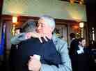 Following the Military Voices launch event, NPR Weekend Edition Saturday host Scott Simon hugs Gordon Bolar, General Manager of NPR Member Station WMUK in Kalamazoo, Michigan. In 2007, Bolar's son Matthew was killed by a roadside bomb in Iraq.
