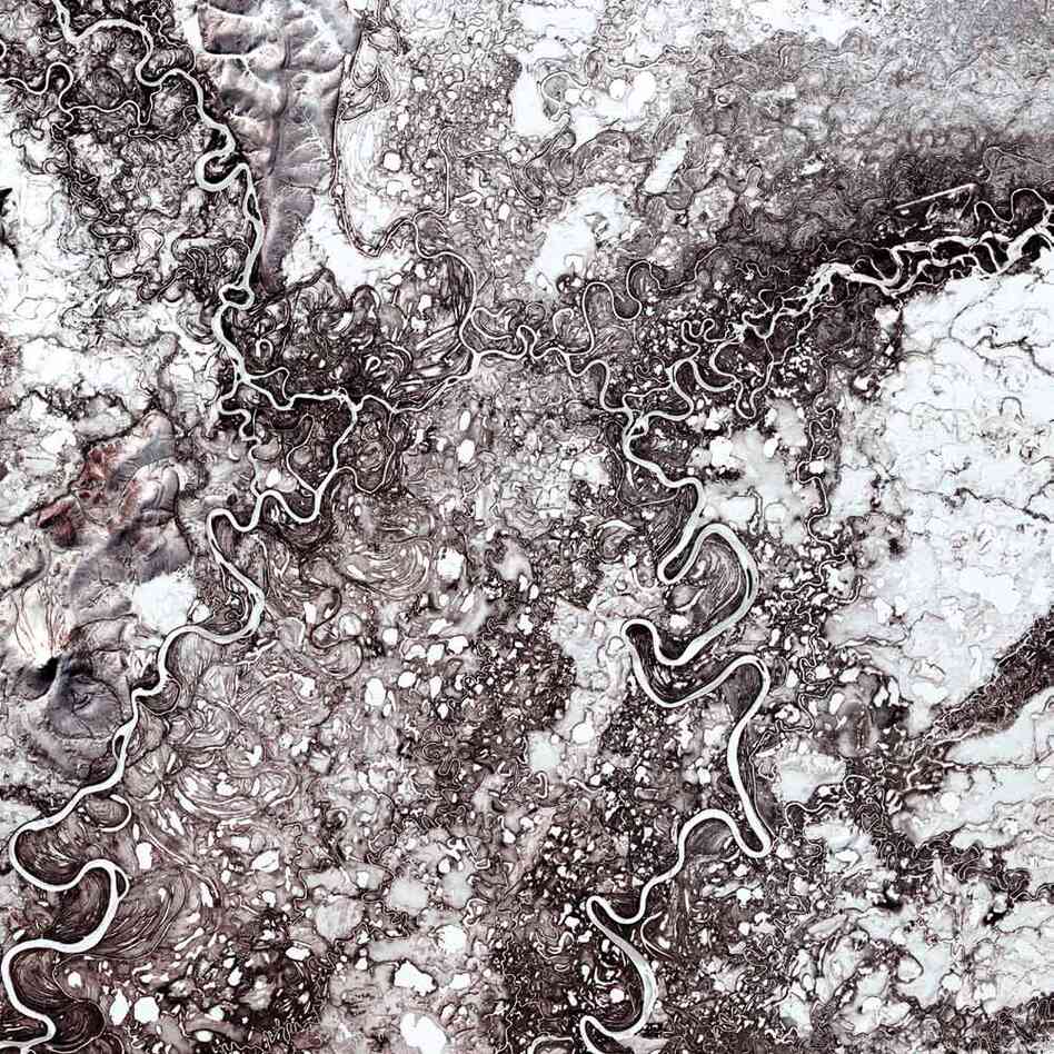 Mayn River, Russia, 2000The Mayn River is a tributary of the larger Anadyr River, which flows through the far northeastern corner of Siberia. While these rivers are frozen for about eight to nine months in a year, they are home to chum and sockeye salmon during the summer months.