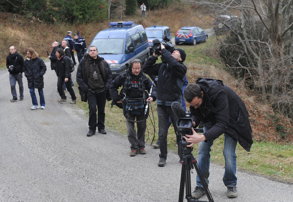 French journalists film the Pic of Bugarach, a mountain in the village that is said to have magical powers.