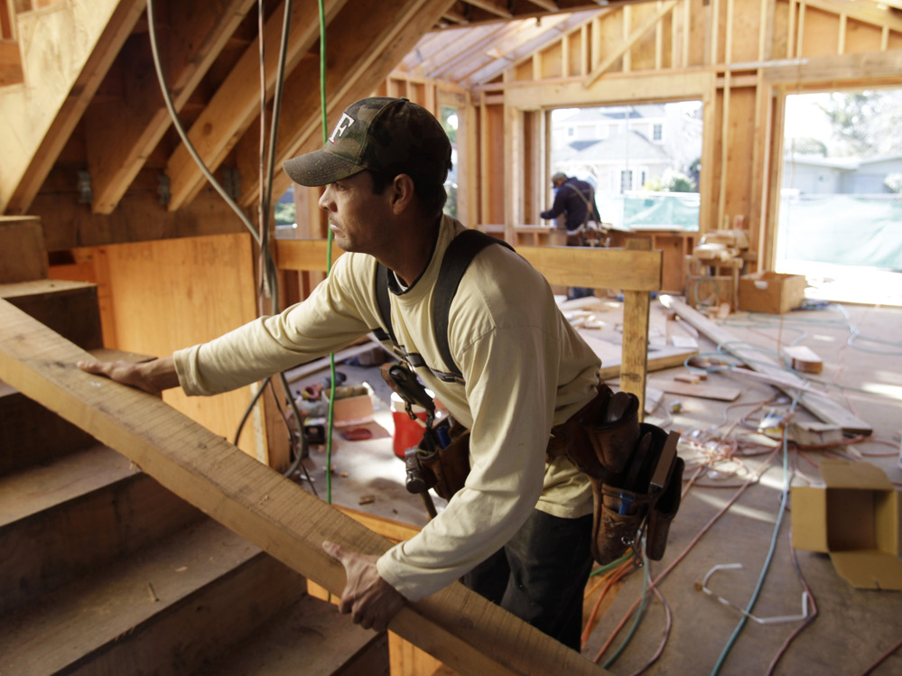 Construction workers build a home in Palo Alto, Calif. A real turnaround seemed to take hold in the housing sector in 2012 after years of fits and starts.