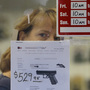 A clerk peers out from a gun shop in Seattle on Wednesday.