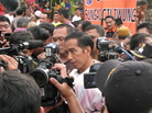 Jakarta Governor Joko Widodo fields reporters' questions after meeting with residents of a Jakarta slum. Recent polls say Widodo is currently the most popular choice for Indonesia's president in 2014. Jakarta Governor Joko Widodo fields reporters' questions after meeting with residents of a Jakarta slum. Recent polls say Widodo is currently the most popular choice for Indonesia's president in 2014.