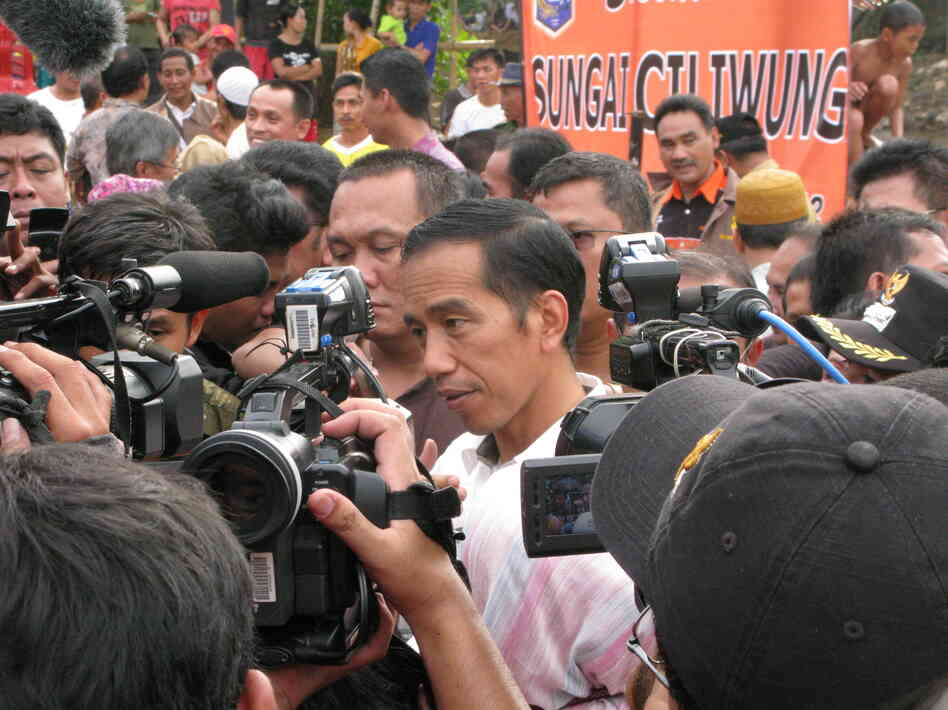 Jakarta Governor Joko Widodo fields reporters' questions after meeting with residents of a Jakarta slum. Recent polls say Widodo is currently the most popular choice for Indonesia's president in 2014. Jakarta Governor Joko Widodo fields reporters' questions after meeting with residents of a Jakarta slum. Recent polls say Widodo is currently the most popular choice for Indonesia's president in 2014.