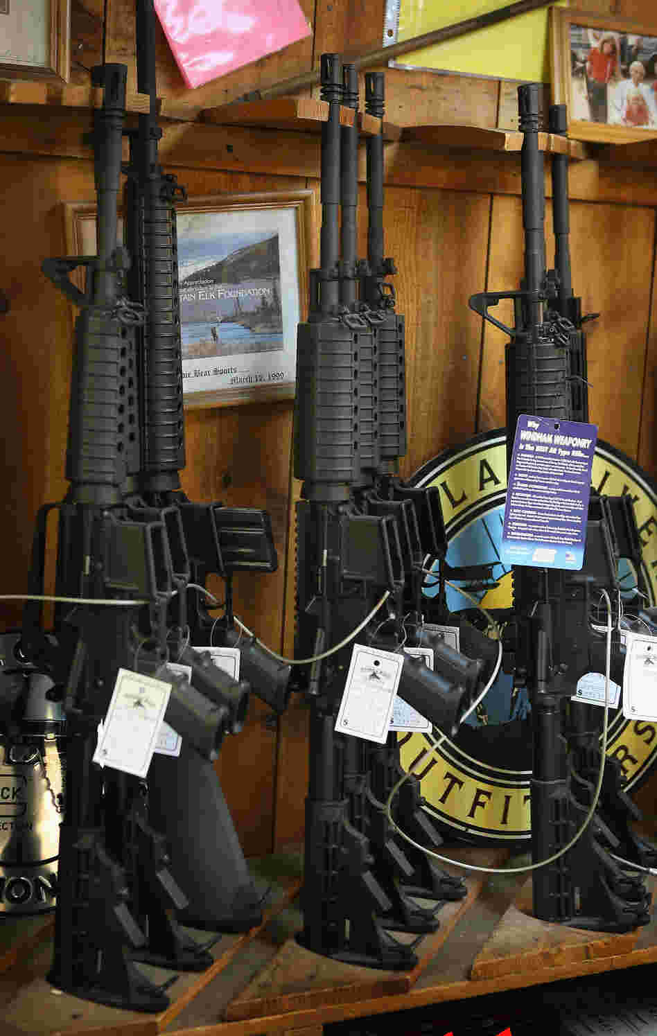 AR-15-style rifles are offered for sale at a sporting goods store in Tinley Park, Ill. AR-15-style rifles are offered for sale at a sporting goods store in Tinley Park, Ill.