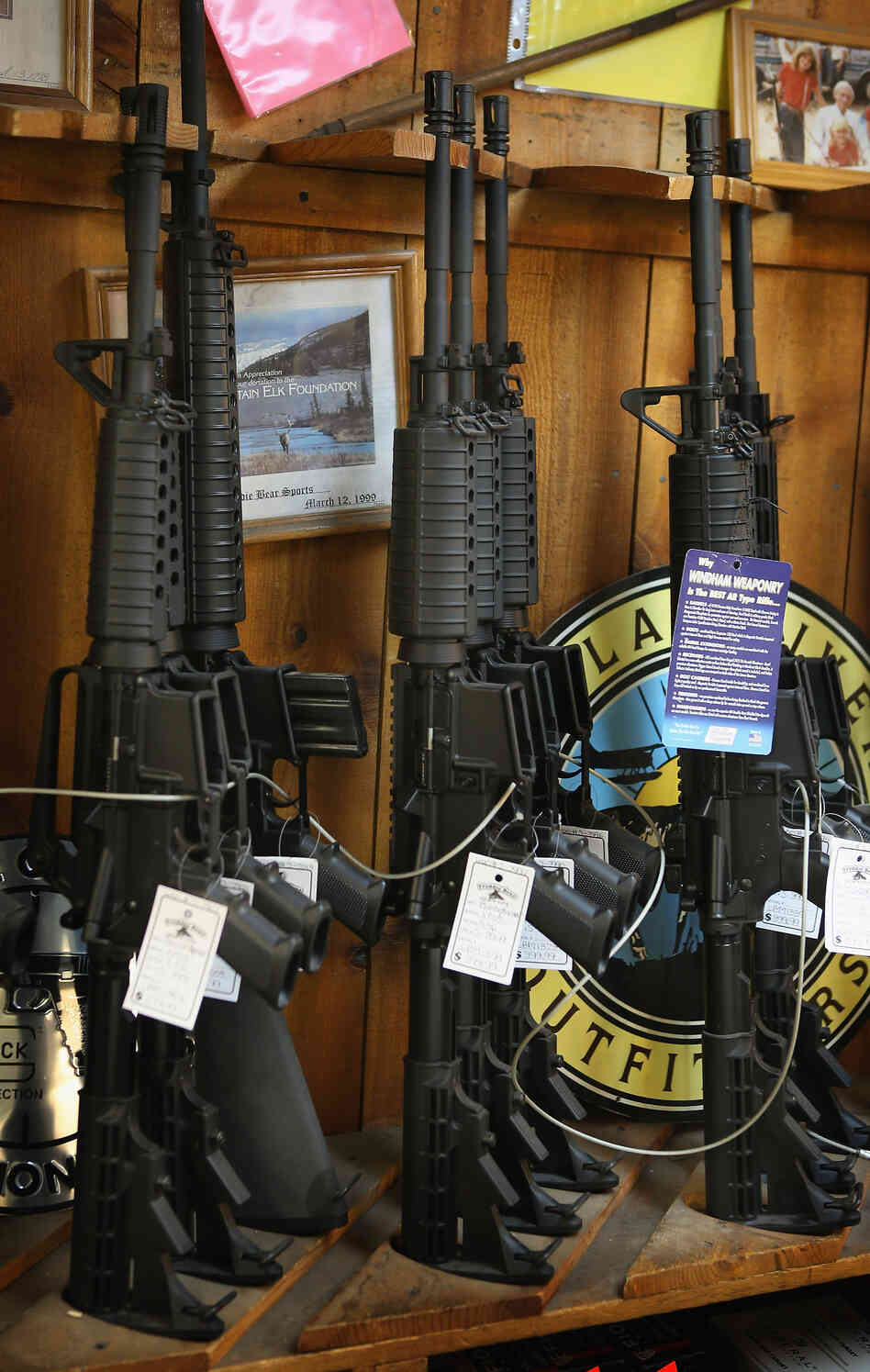 AR-15-style rifles are offered for sale at a sporting goods store in Tinley Park, Ill. AR-15-style rifles are offered for sale at a sporting goods store in Tinley Park, Ill.