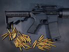 In this photo illustration, a Rock River Arms AR-15 rifle is seen with ammunition. In this photo illustration, a Rock River Arms AR-15 rifle is seen with ammunition.