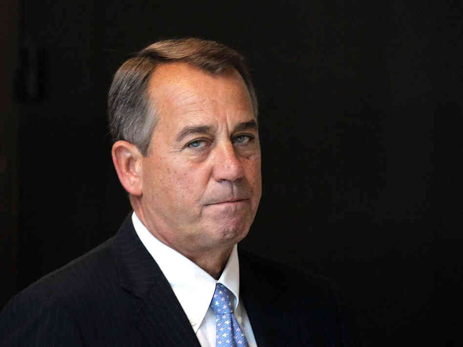 House Speaker John Boehner (R-OH) arrives on Capitol Hill Thursday. The House has postponed an expected vote on the tax portion of the fiscal cliff cuts.