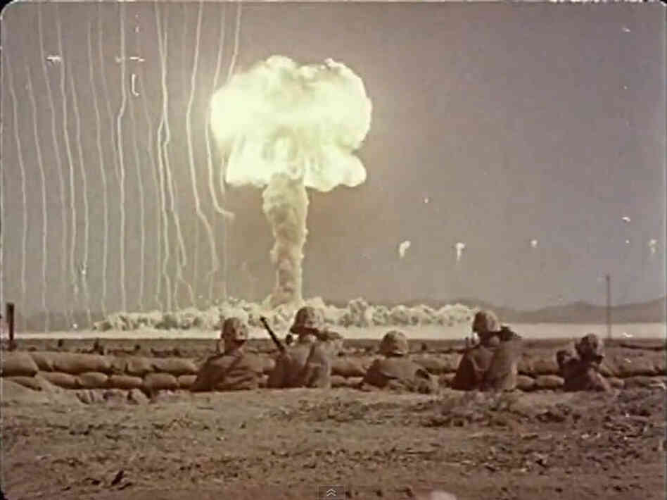 A bomb blast with soldiers