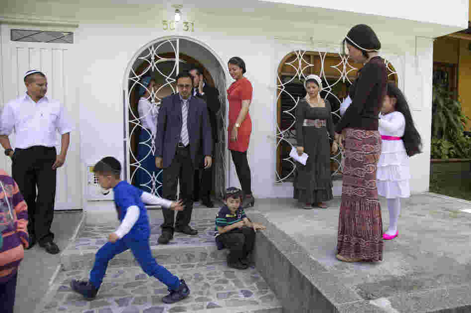 Worshippers leave the synagogue after morning prayers.