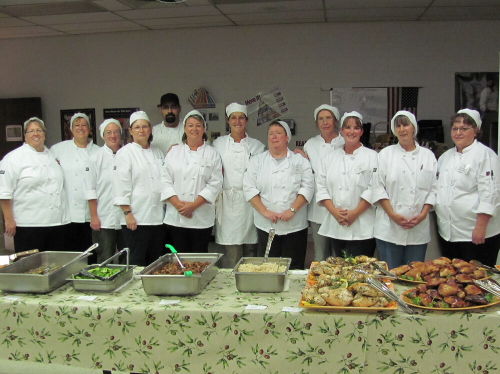 Kathy Del Tonto (far right) participates in a class that teaches school cafeteria workers how to prepare meals from scratch.