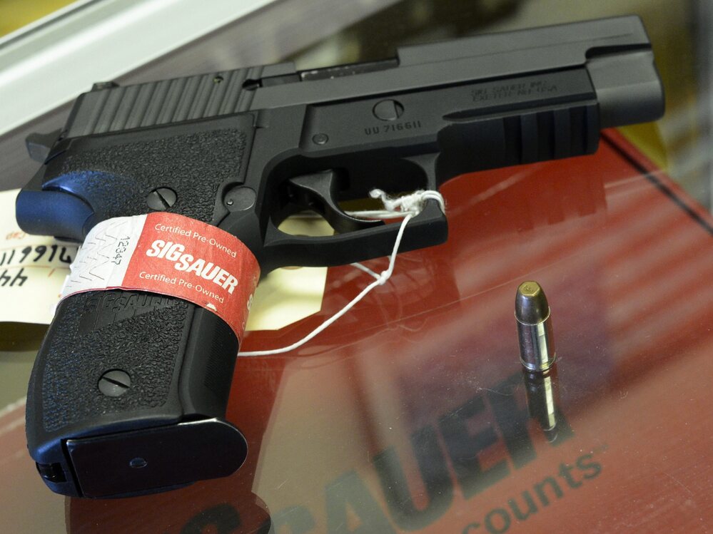 A Sig Sauer handgun on sale at a shop in Tucker, Ga.
