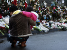A woman and child earlier this week at a makeshift memorial in Newtown, Conn. A woman and child earlier this week at a makeshift memorial in Newtown, Conn.
