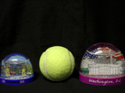 One of these snow globes doesn't belong onboard. The one on the left, which is about the size of a tennis ball, is permitted in your carry-on luggage. The one on the right is not. One of these snow globes doesn't belong onboard. The one on the left, which is about the size of a tennis ball, is permitted in your carry-on luggage. The one on the right is not.