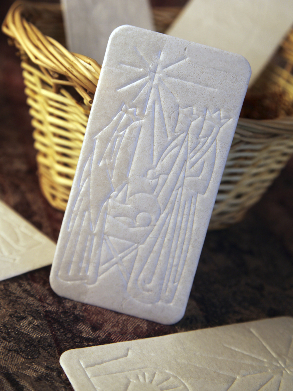 The oplatek, embossed with a Christmas scene, is shared among family members before Christmas Eve dinner. The oplatek, embossed with a Christmas scene, is shared among family members before Christmas Eve dinner.