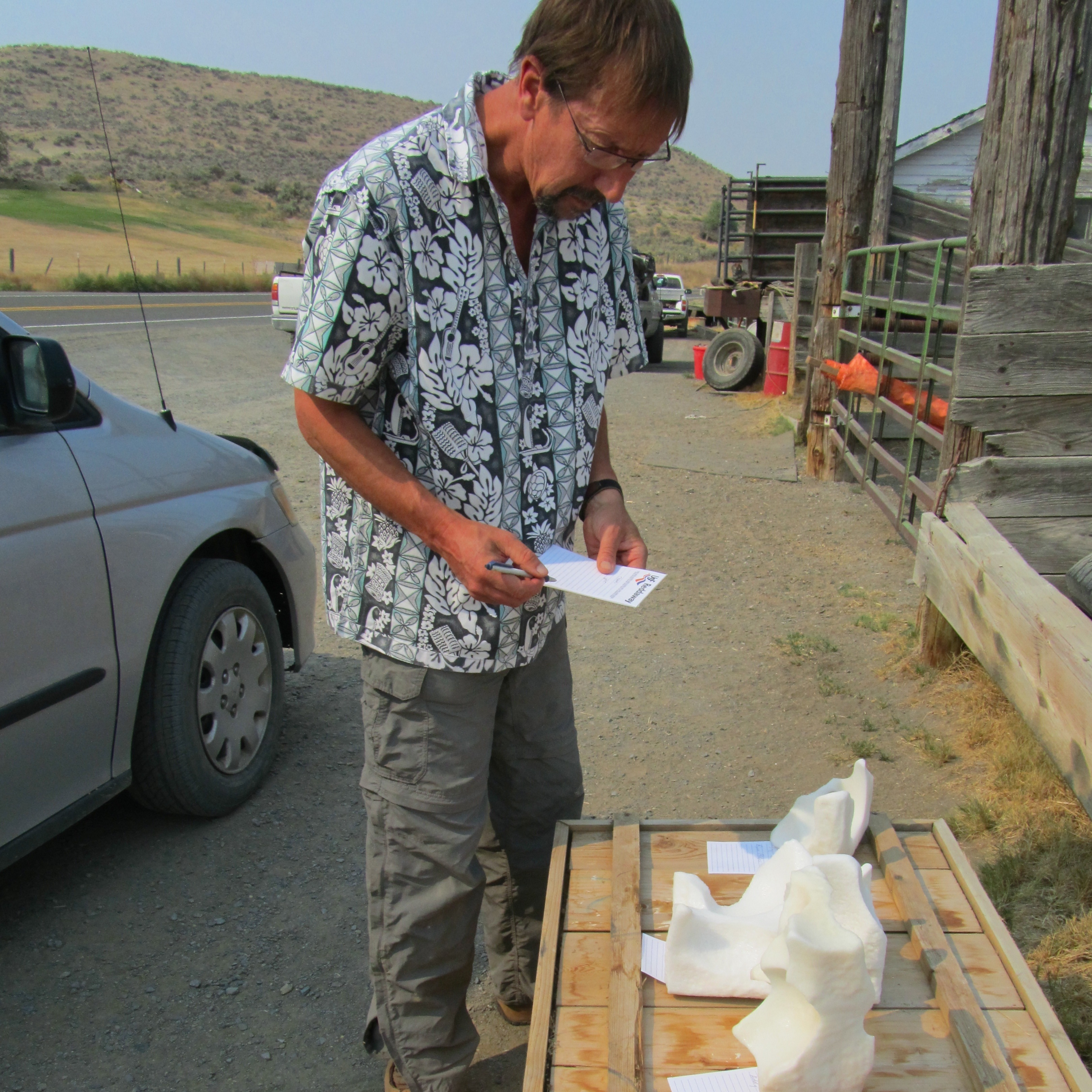 Organizer Whit Deschner examines four licks left for him by a local rancher.