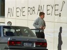 After a 1996 mass killing, Australia tightened its gun laws. Here, graffiti covers the wall of the hospital holding the suspect of the massacre that left 35 people dead. After a 1996 mass killing, Australia tightened its gun laws. Here, graffiti covers the wall of the hospital holding the suspect of the massacre that left 35 people dead.