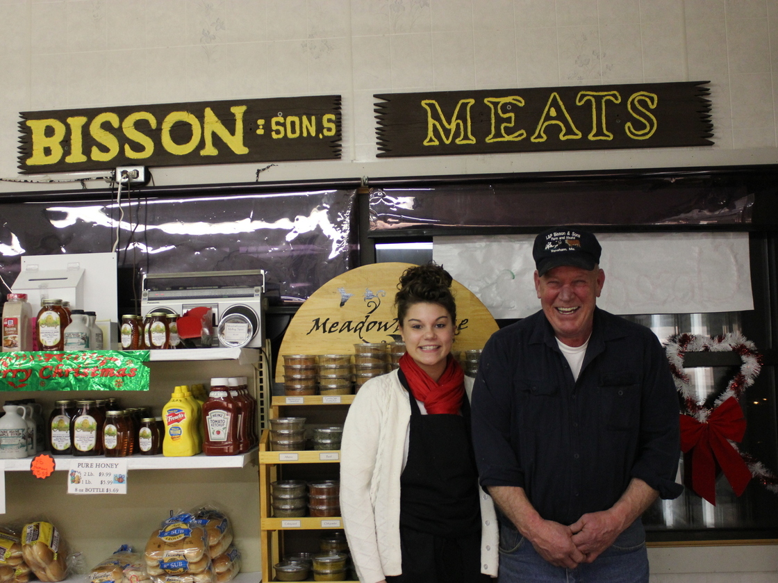 Robert Bisson of Bisson and Sons Meat Market in Topsham, Maine, with his granddaughter. The butcher shop sells traditional cretons during the holidays.