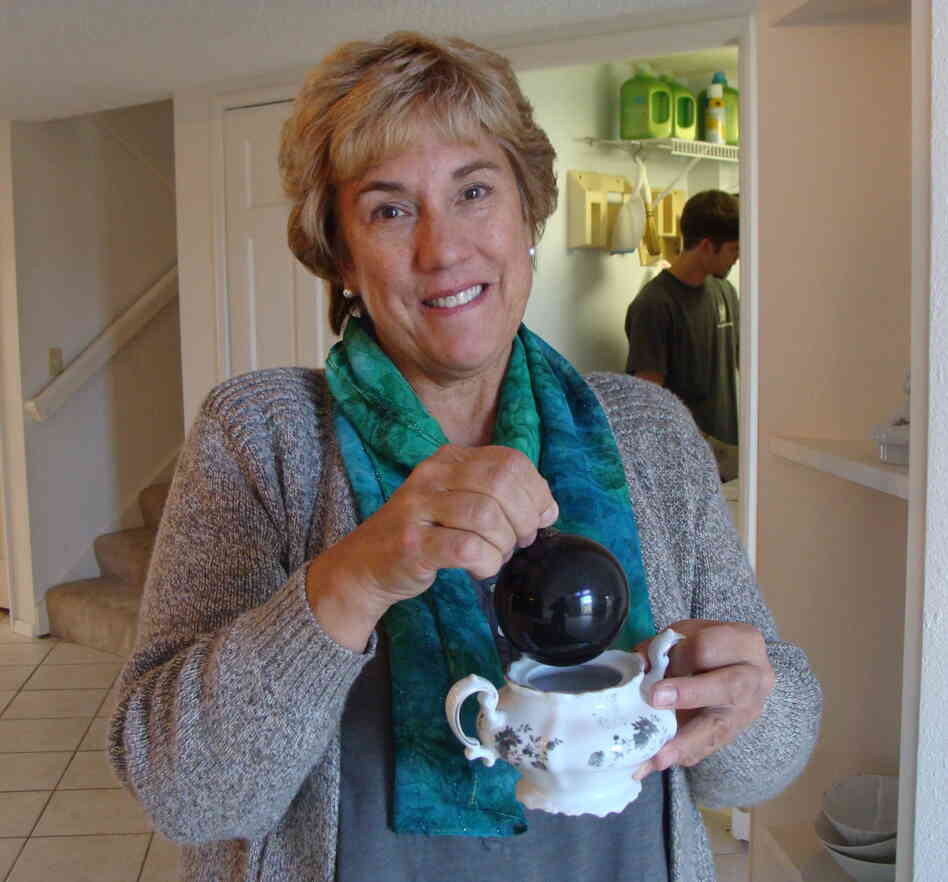 Janet Wilson salvaged a few things from the ashes of her former house, including her mother's sugar bowl and a single, fire-scorched Christmas ornament. Janet Wilson salvaged a few things from the ashes of her former house, including her mother's sugar bowl and a single, fire-scorched Christmas ornament.