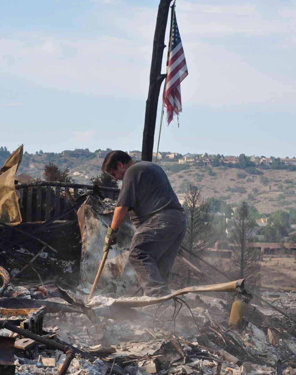As soon as they were allowed back into the neighborhood, family members joined Janet Wilson in searching through the rubble of her house. As soon as they were allowed back into the neighborhood, family members joined Janet Wilson in searching through the rubble of her house.