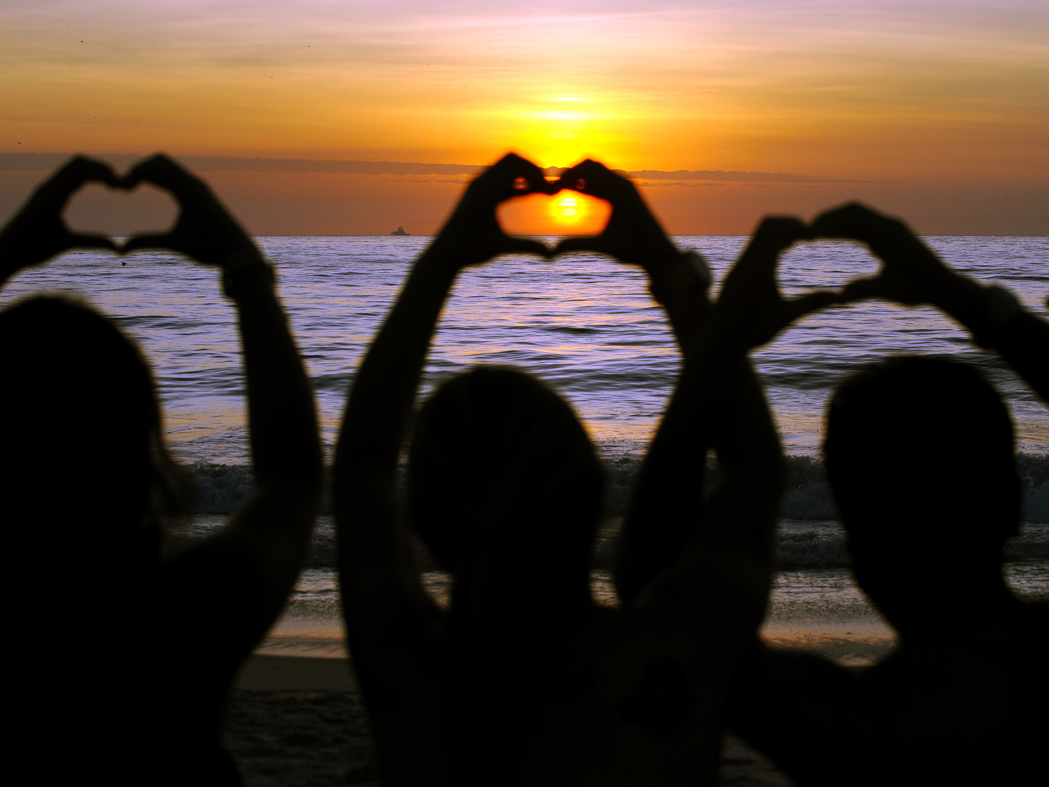 This morning on a beach in Brazil, some celebrated summer's first day — and the news that the world didn't end.