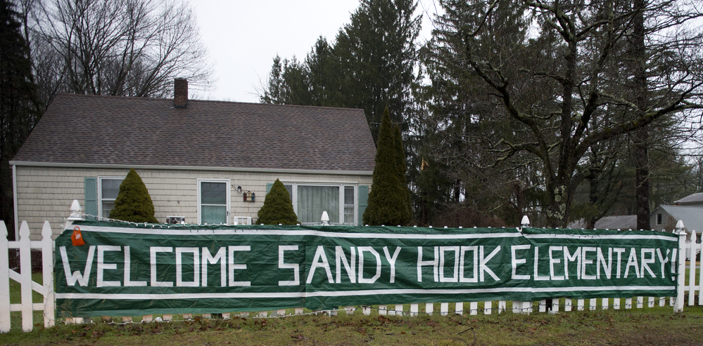 A sign near Chalk Hill Middle School greets students from Sandy Hook in Monroe, Conn. The students will start taking classes at the currently unused Chalk Hill school in January. A sign near Chalk Hill Middle School greets students from Sandy Hook in Monroe, Conn. The students will start taking classes at the currently unused Chalk Hill school in January.